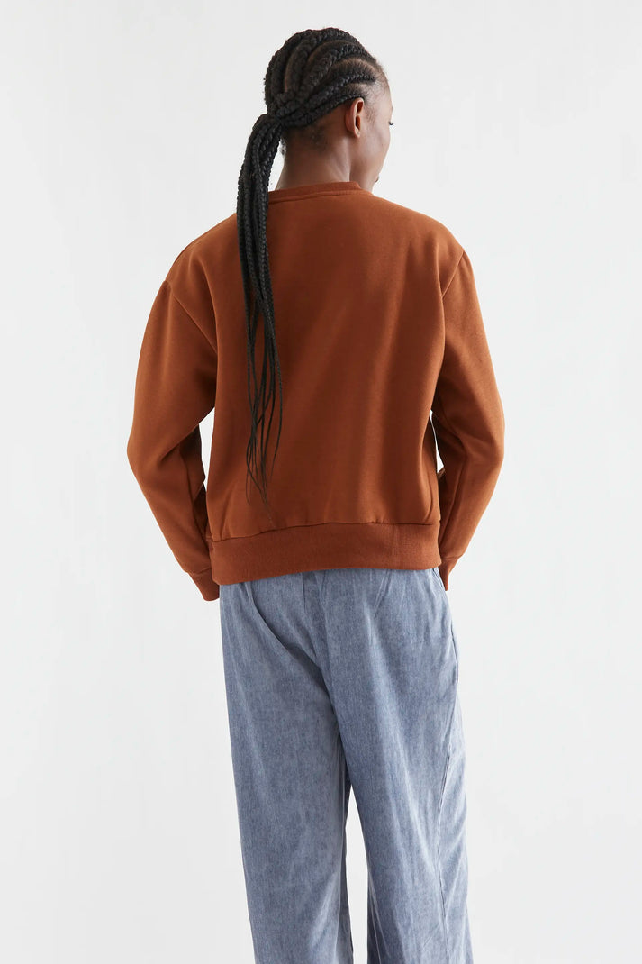 Zwarte sweater met goudkleurige "juwelen"kraag